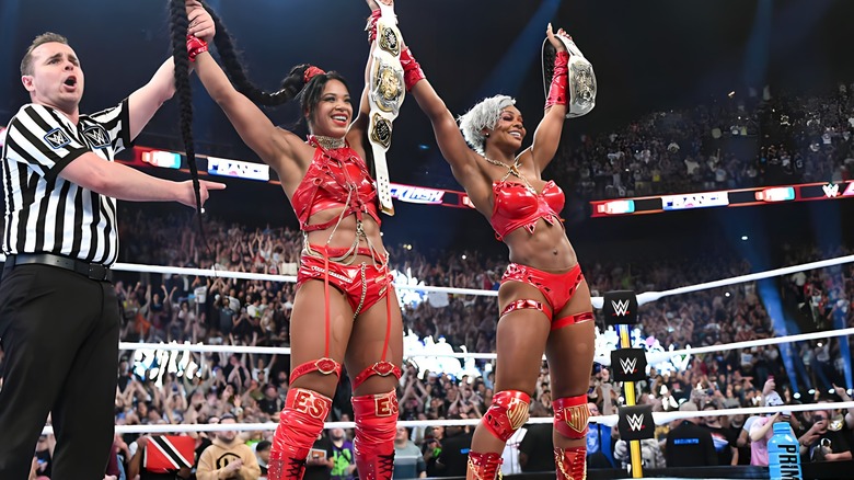Bianca Belaire and Jade Cargill raise the title belts