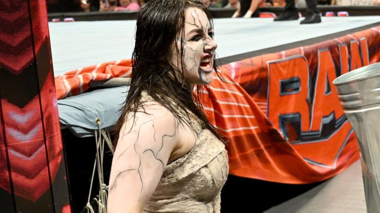 Nikki Cross, dressed in her Wyatt Sicks gimmick, snarls at ringside during a match on an episode of 