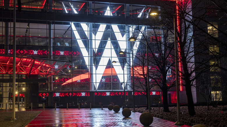 A giant WWE logo shines from the WWE world headquarters on January 28, 2024 in Stamford, Connecticut. WWE founder Vince McMahon resigned from the WWE and its parent company TKO as executive chairman and board of directors following allegations of sexual assault in a Connecticut lawsuit. A former employee Janel Grant accused McMahon, 78, of sexual assault and sexually trafficking her.