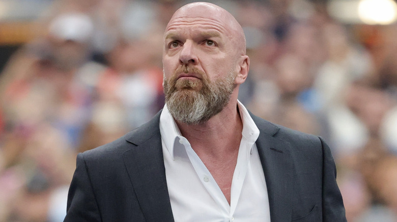 Triple H wearing a suit