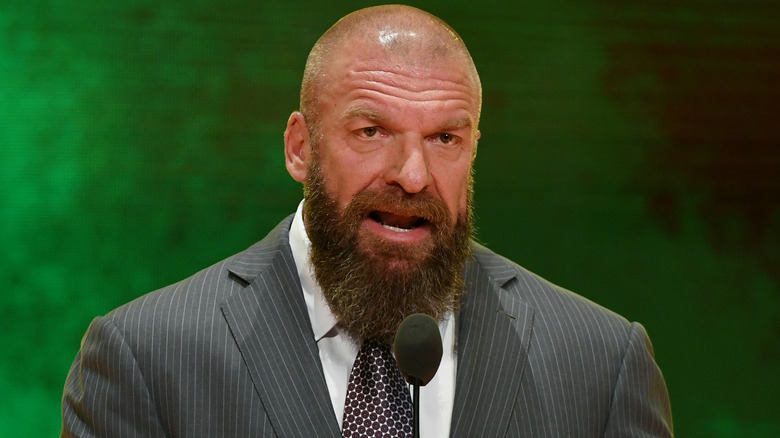 Triple H wearing a suit