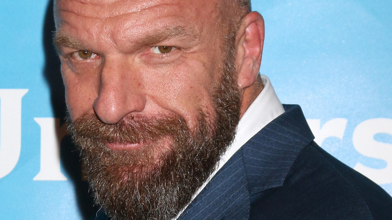 Triple H smirking