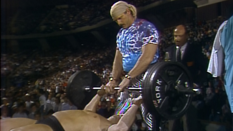 Jesse Ventura spotting as Dino Bravo bench presses