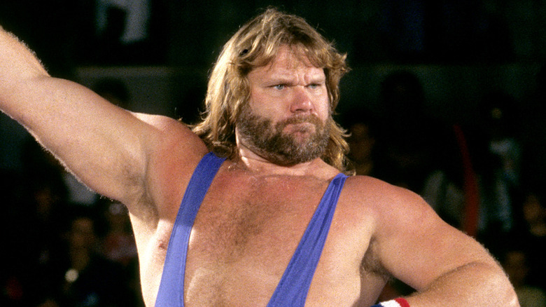 WWE star Hacksaw Jim Duggan posing in the ring