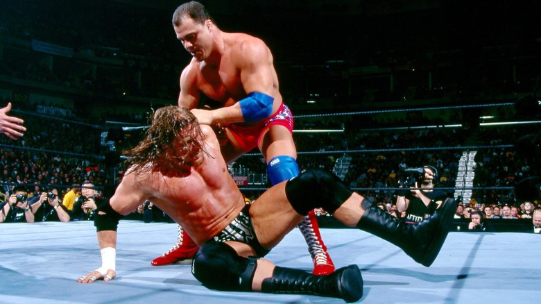 Triple H grapples with Kurt Angle