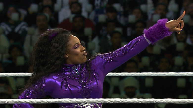 Lash Legend points ahead to the WrestleMania sign