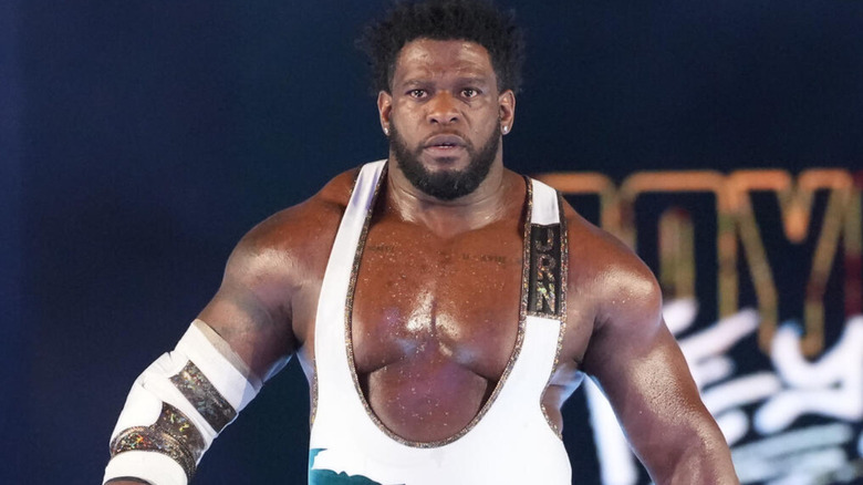 Royce Keys wearing a white singlet