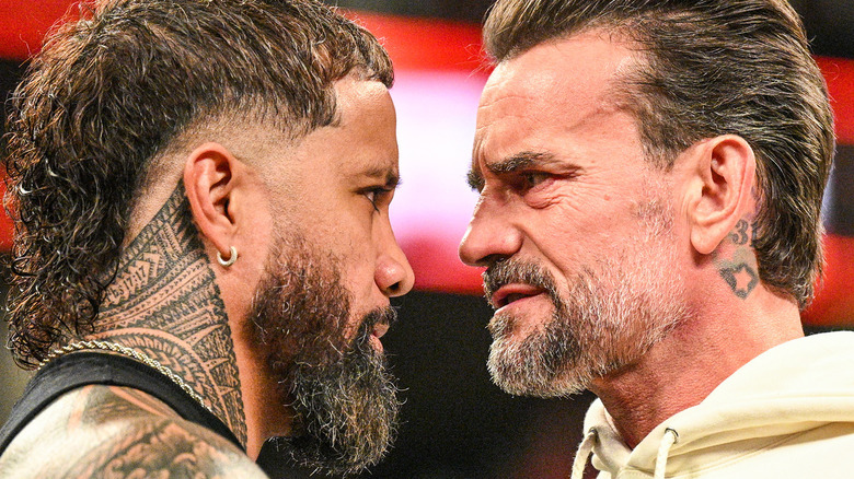 Jey Uso and CM Punk facing off on WWE Raw