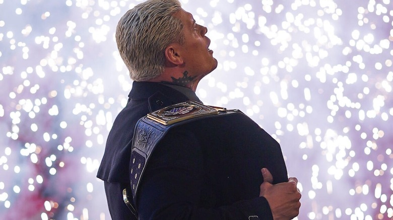 Cody Rhodes stands in pyro with his title belt on "WWE SmackDown"