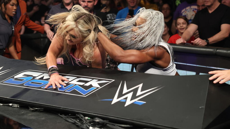 Jade Cargill throws Tiffany Stratton over the announce table on "WWE SmackDown"