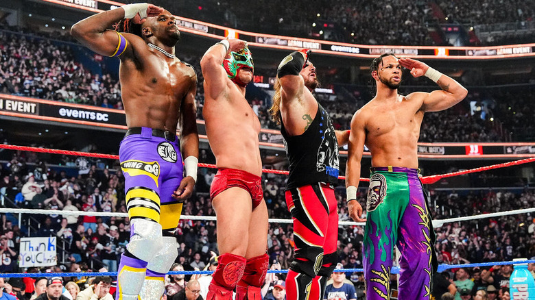 Je'Von Evans, Dragon Lee, AJ Styles, and Leon Slater hit a salute, a la John Cena, in the middle of the ring after their match at Saturday Night's Main Event.