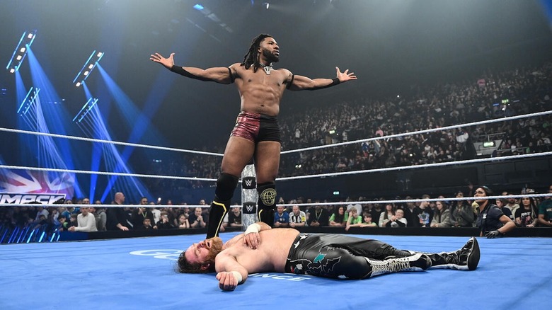Trick Williams poses above Sami Zayn on "WWE SmackDown"