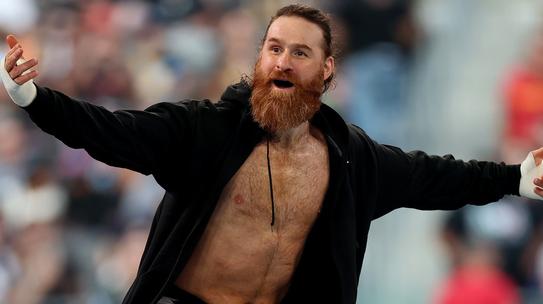 Sami Zayn is wearing a black hoodie