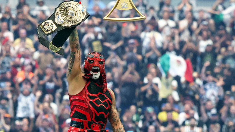 Penta celebrates with the WWE IC Title