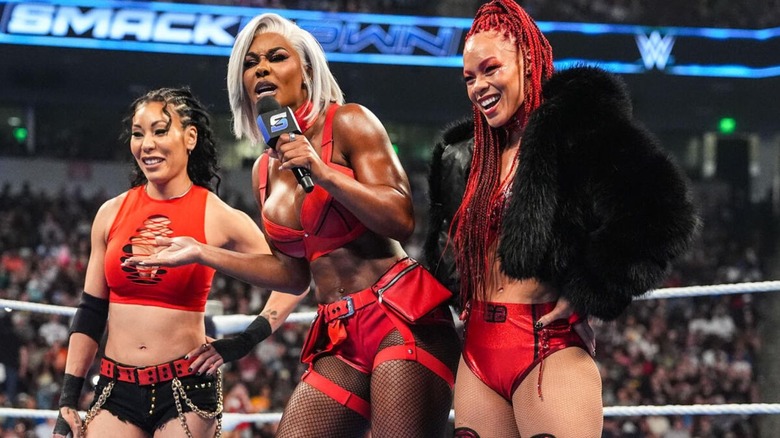 Jade Cargill cuts a promo in the ring, flanked by Michin and B-Fab, during an episode of "WWE SmackDown."
