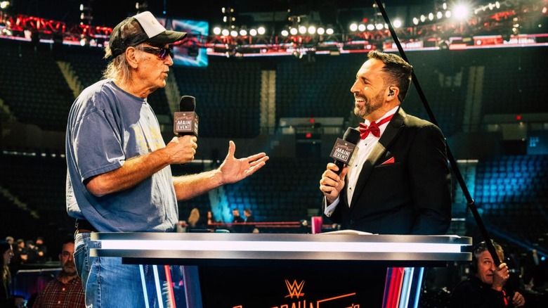 Jesse Ventura talks to Joe Tessitore during rehearsals for WWE Saturday Night's Main Event.