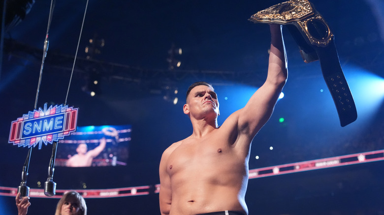 Gunther holds his title belt high