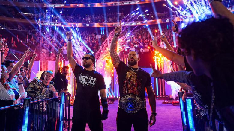 Roman Reigns and Jalen Brunson make an entrance