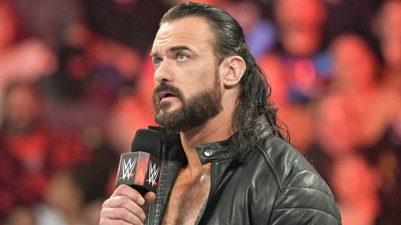 Drew McIntyre speaks into a WWE microphone during an episode of WWE Raw