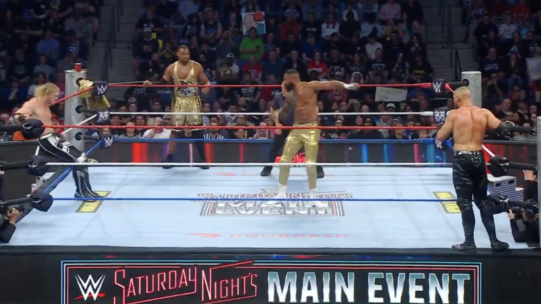 All four men in and around the ring