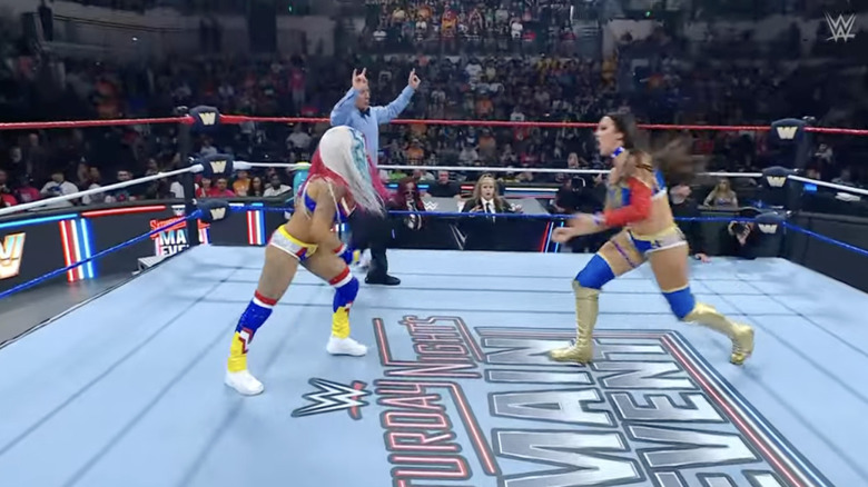 Vega and Green brawling in the ring