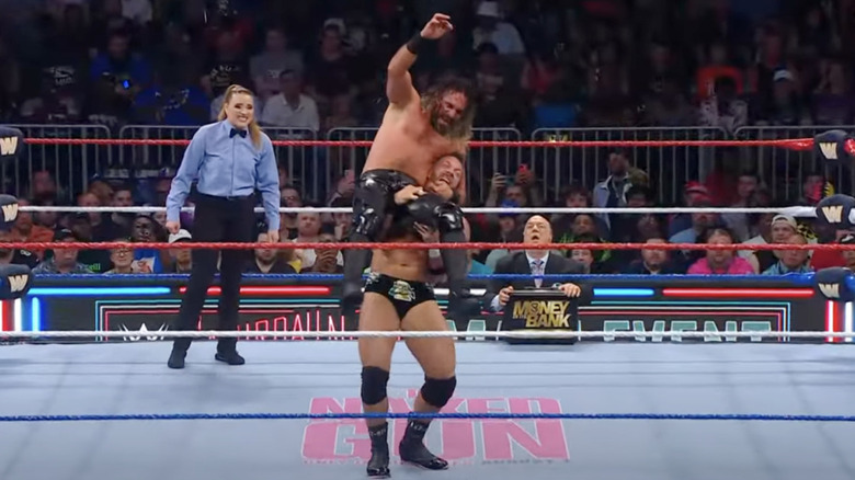 Knight with Rollins up on his shoulders