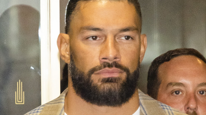 Roman Reigns exiting building