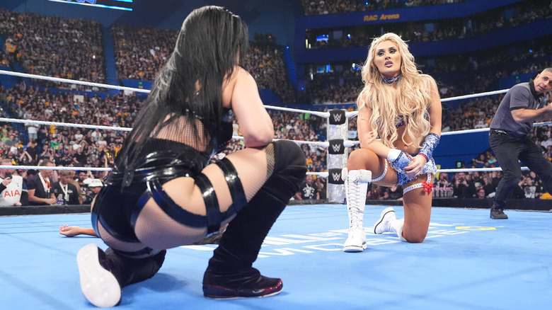Stephanie Vaquer and Tiffany Stratton stare each other down in the ring while crouching on "WWE SmackDown"