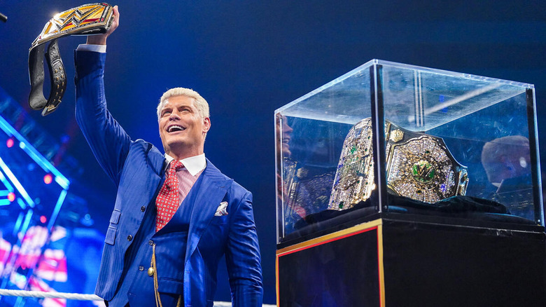 Cody Rhodes holds up WWE title while standing beside Crown Jewel title on "SmackDown"