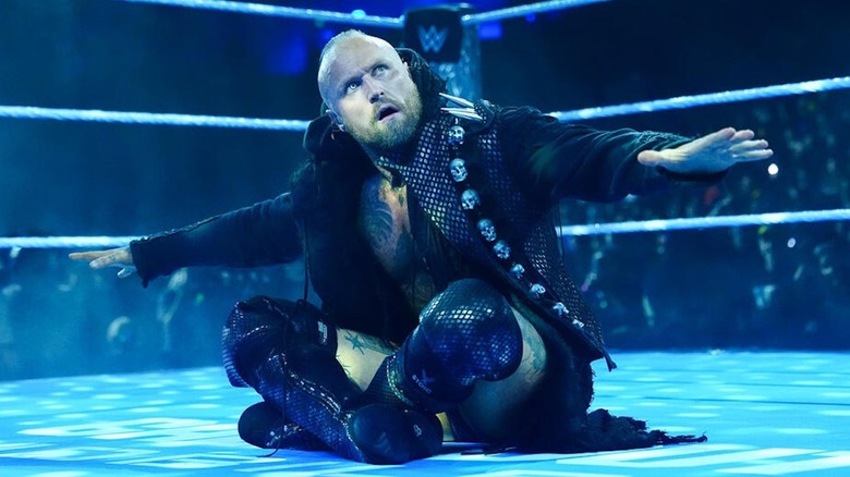 Aleister Black sits cross-legged in the ring on "WWE SmackDown"