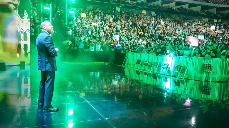 Triple H surveys the audience