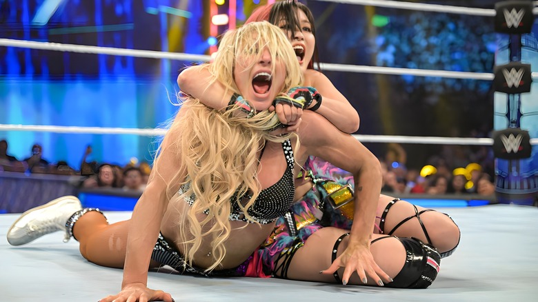 IYO SKY.tries to tap out Charlotte Flair