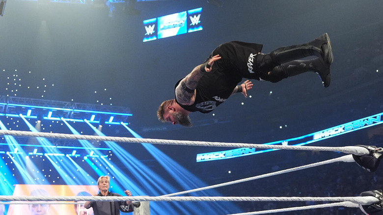 Kevin Owens dives off the top rope