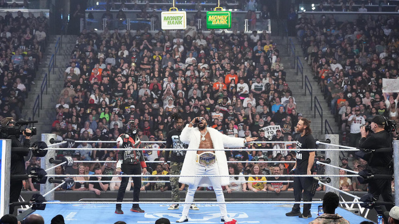 Trick Williams addresses the crowd, as well as Je'Von Evans, Penta, and Sami Zayn