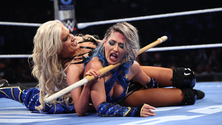 Blake Monroe applies a hold to Giulia using a kendo stick in the ring on "WWE SmackDown"