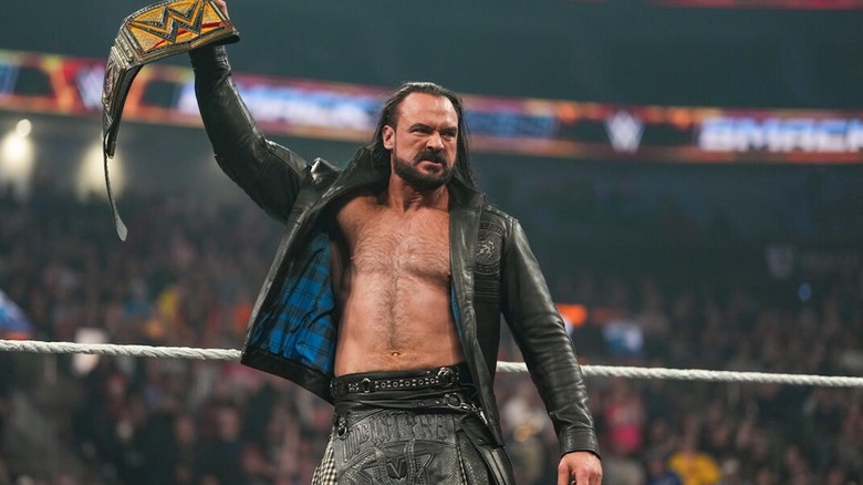 Drew McIntyre raises the WWE Championship on "SmackDown"