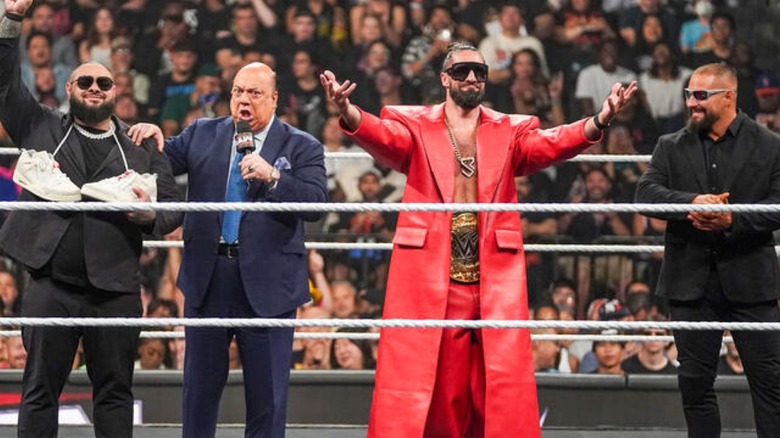 The Vision stand together in the ring