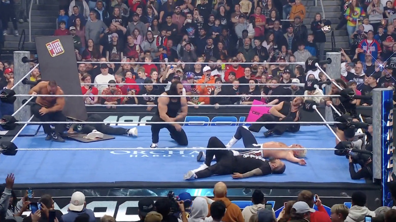 The Vision, The Usos, Rhodes, and McIntyre in the ring