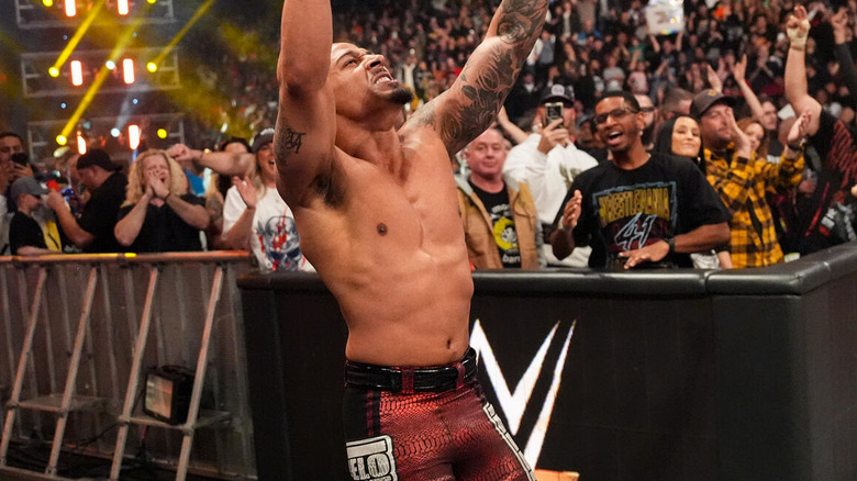 Carmelo Hayes raises his arms after winning on "WWE SmackDown"