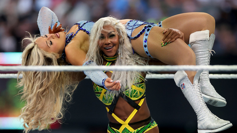 Jade Cargill carries Tiffany Stratton