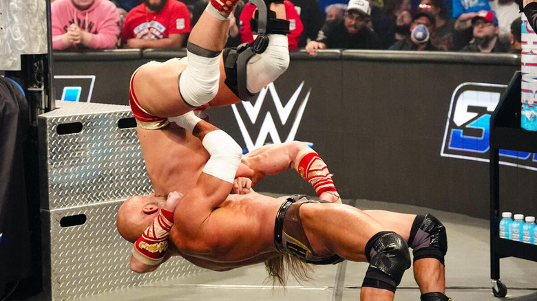 Tommaso Ciampa suplexes Ilja Dragunov