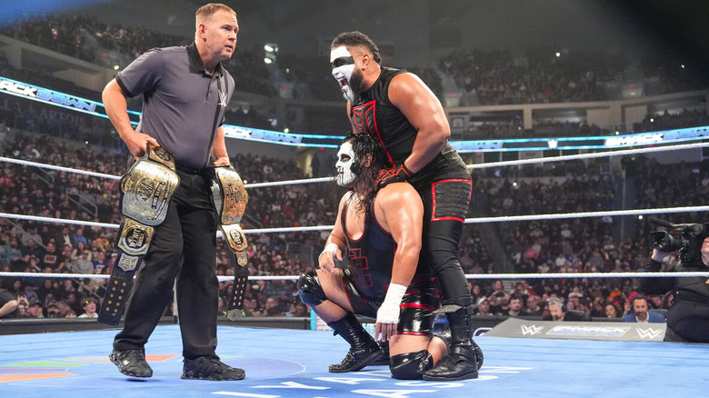 MFT stares at the tag titles held by the referee on "WWE SmackDown"