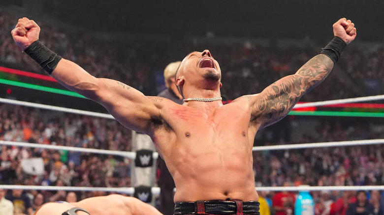 Carmelo Hayes celebrates his title win