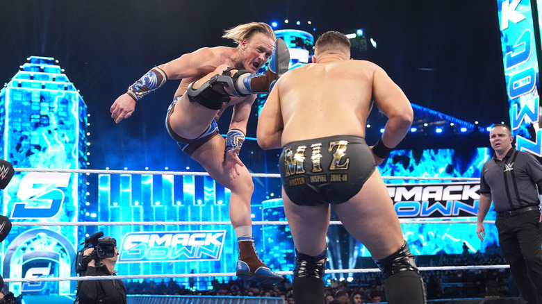 Ilja Dragunov kicking The Miz on "WWE SmackDown"