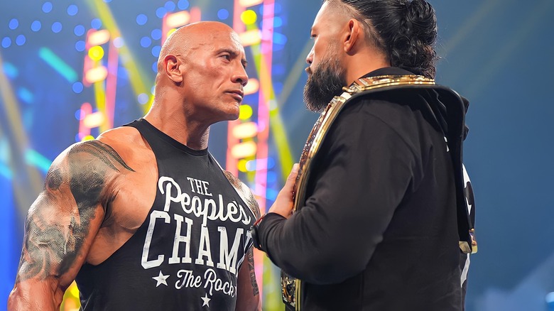 The Rock stares down Roman Reigns