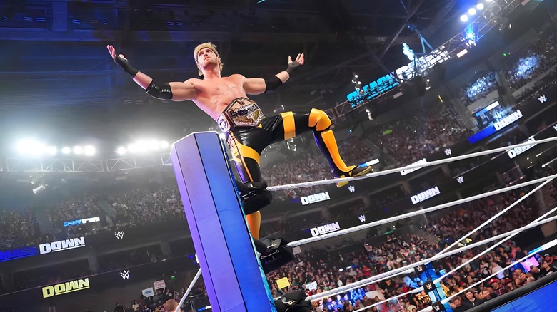Logan Paul stands on turnbuckle with arms wide