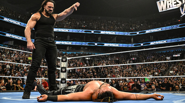 Drew McIntyre gives a thumbs down to a fallen Jacob Fatu on "WWE SmackDown"