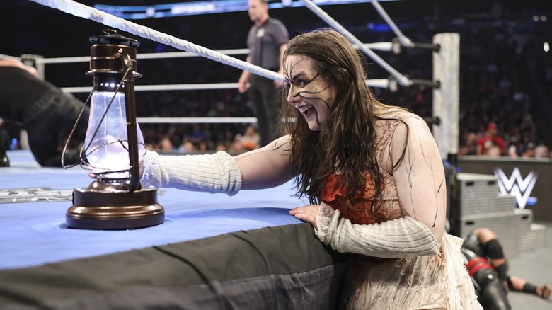 Nikki Cross stares at a lantern on "WWE SmackDown"