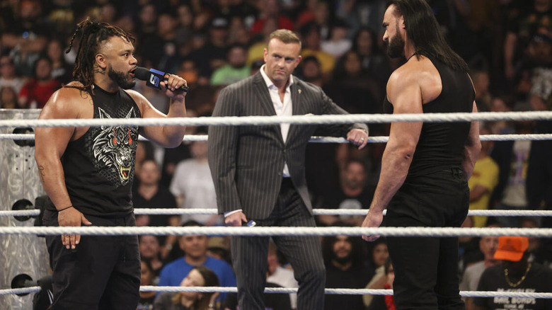 Jacob Fatu speaks to Drew McIntyre as Nick Aldis looks on on "WWE SmackDown"