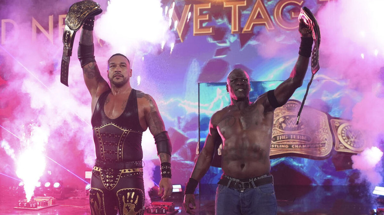 Damian Priest and R-Truth hold up the tag titles on "WWE SmackDown"